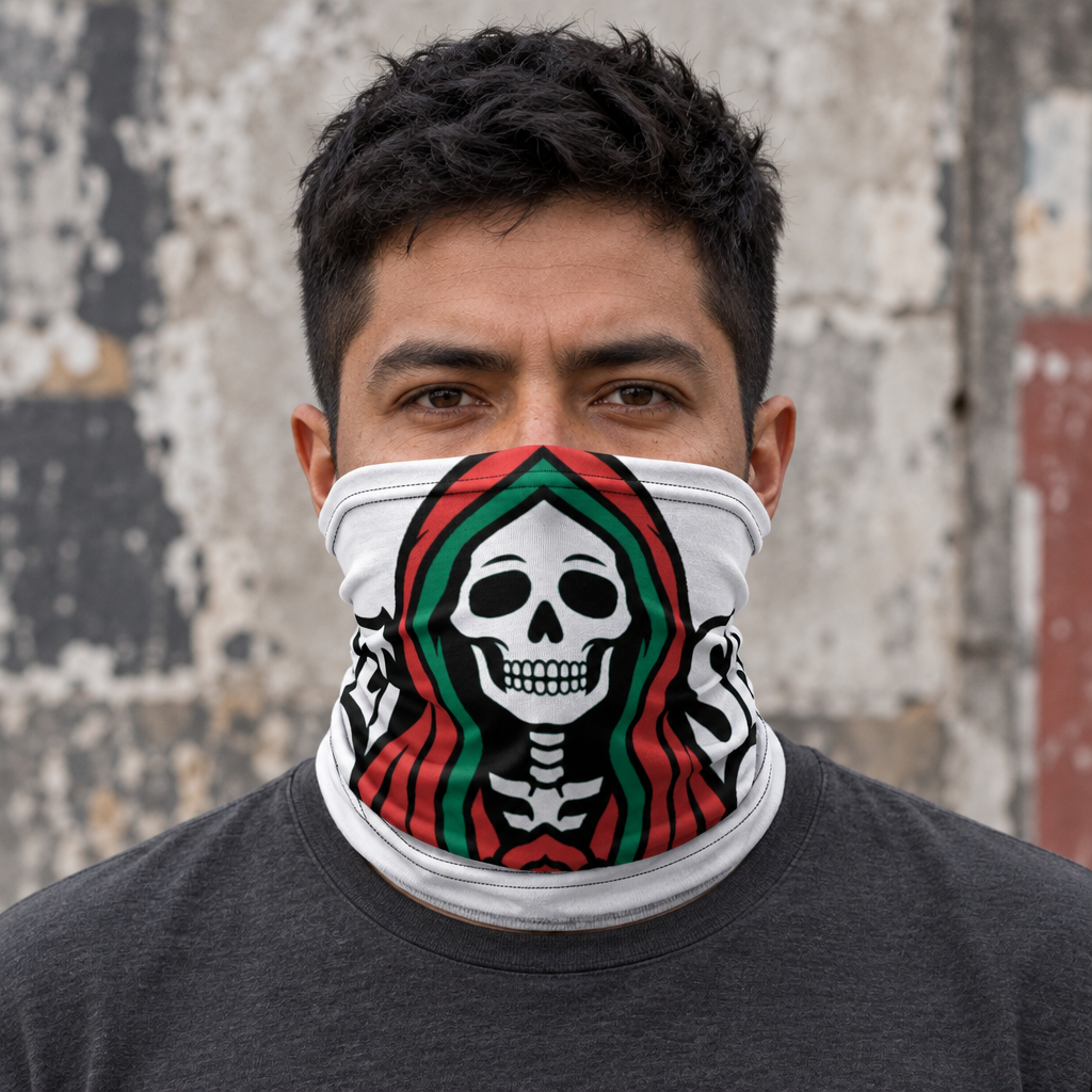 A man wearing a white neck gaiter face mask with a printed graphic of a skeleton wearing a red and green hood, set against a textured concrete wall background.