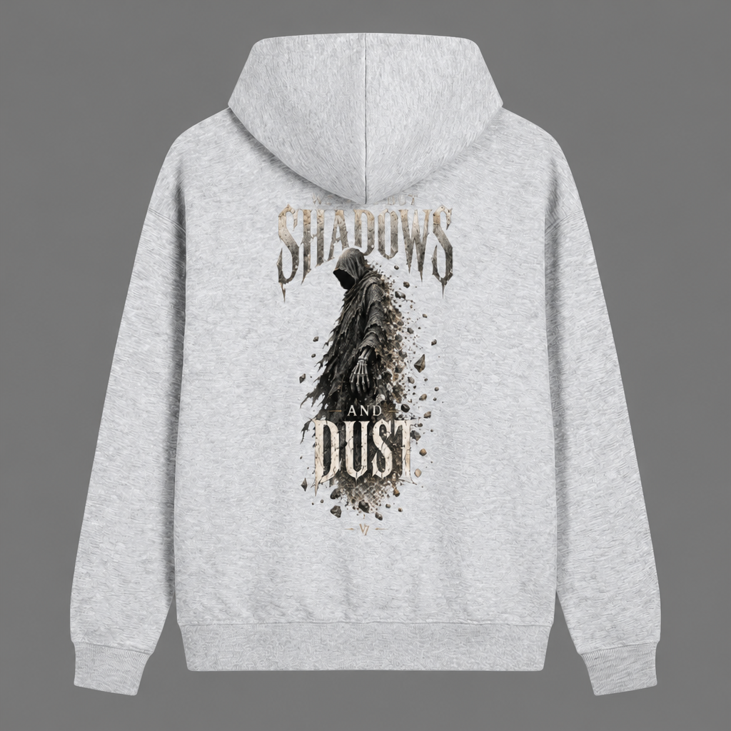 A light heather gray hoodie shown from the back, featuring a graphic print of a hooded figure with a skeletal hand, surrounded by the words 'SHADOWS AND DUST' in a distressed font.