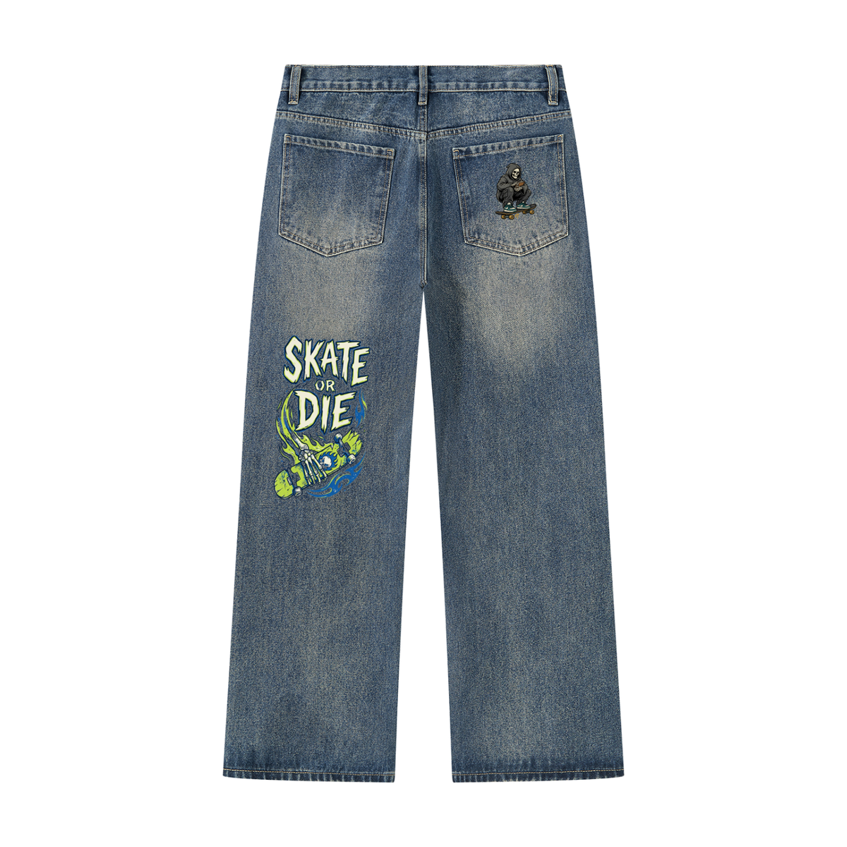 Back view of blue denim jeans featuring a 'SKATE OR DIE' graphic on the left leg and a small skull-and-crossbones patch on the right back pocket, shown on a plain white background.