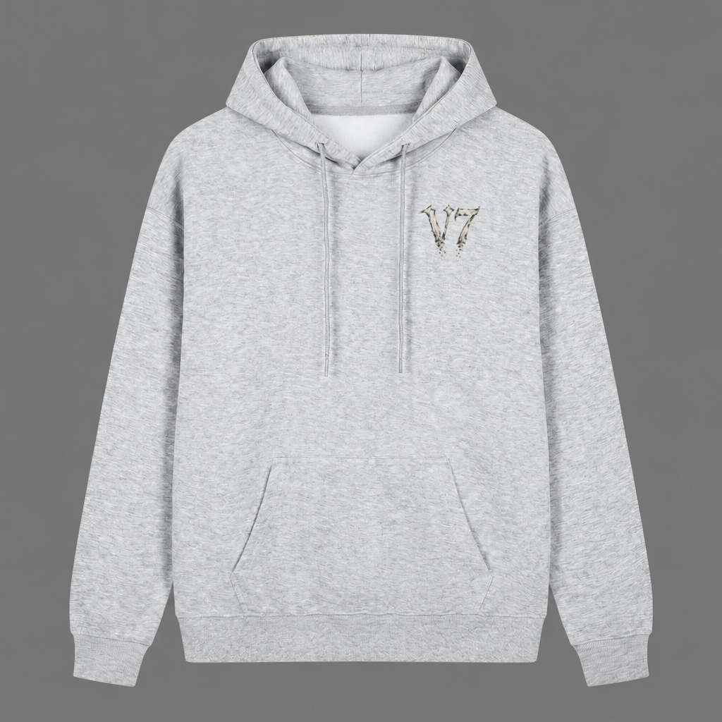 A light heather gray pullover hoodie with a small embroidered metallic 'V7' logo on the left chest, displayed against a solid gray background.