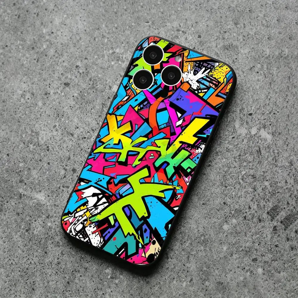 A phone case featuring a vibrant, multicolored graffiti art design, shown from a top-down perspective on a textured gray concrete surface.