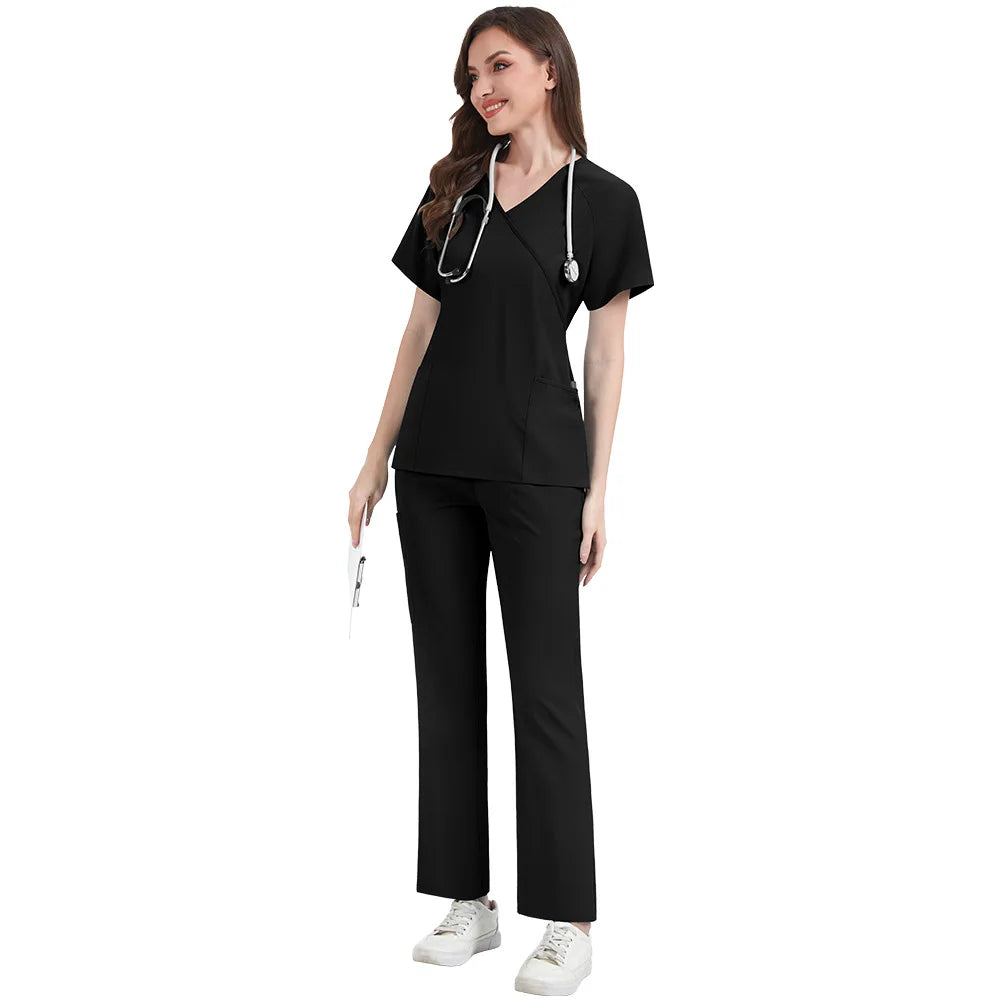 Woman wearing a black medical scrub set on a white background