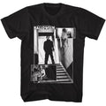 A black short-sleeve crewneck t-shirt featuring a large black-and-white graphic print from the movie 'Halloween' on the front, displayed against a solid white background.