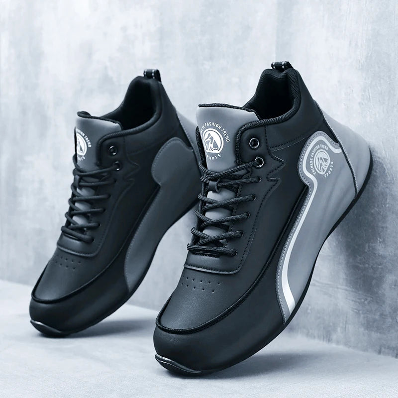 Black and gray sneakers with brand logo on a light gray background