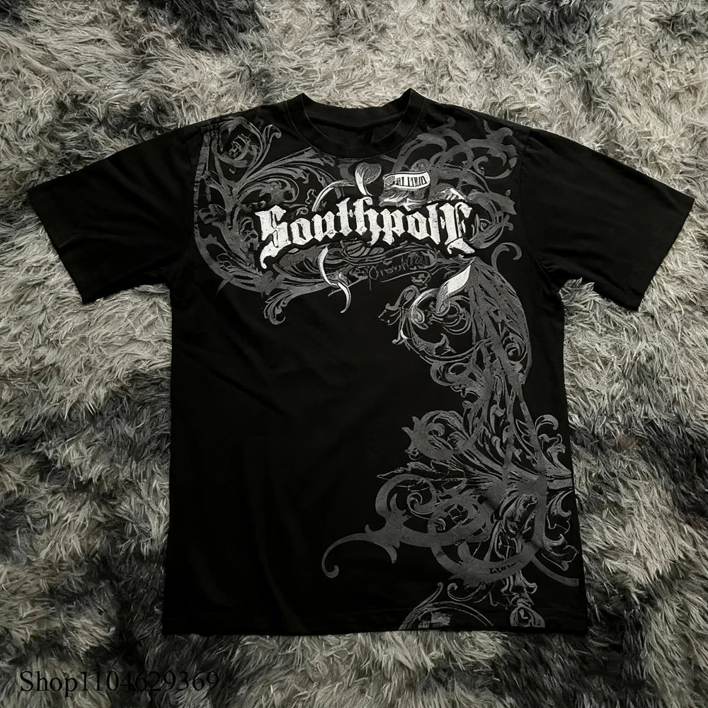 Black t-shirt with intricate designs and text on a textured surface