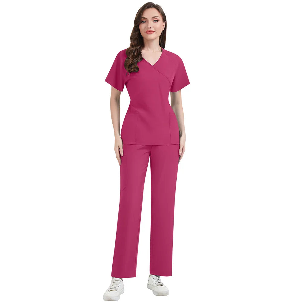 Woman wearing a magenta scrub set on a white background