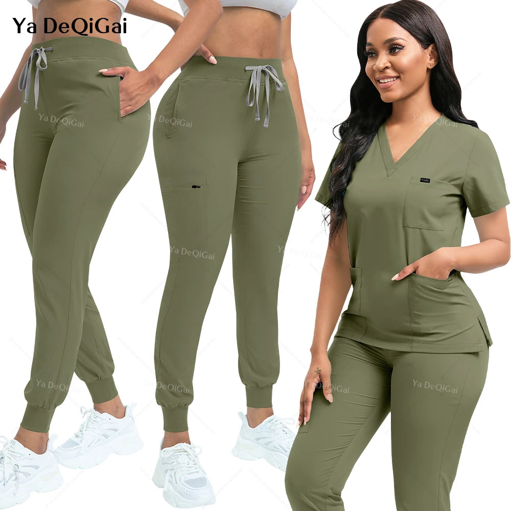 Green scrub set with pants and top on a white background, featuring the brand 'Ya De Qi Gai'.