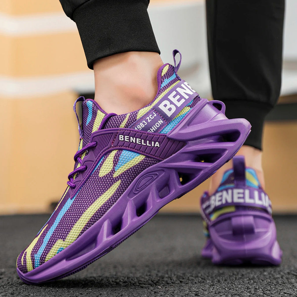 A person wearing purple Benellia athletic sneakers with a knit upper featuring purple, blue, and yellow stripes, standing on a dark textured floor.