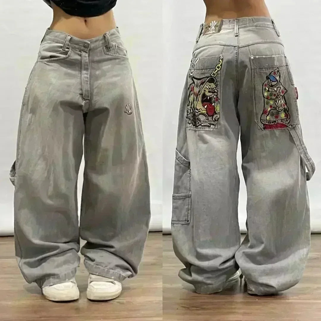 Gray baggy pants with colorful patches on a plain background