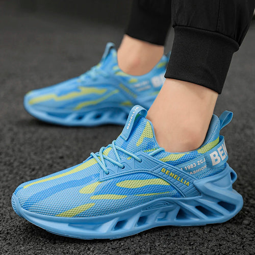 A close-up of a person wearing light blue athletic sneakers with yellow accents and a chunky sculpted sole, standing on a dark textured pavement surface.