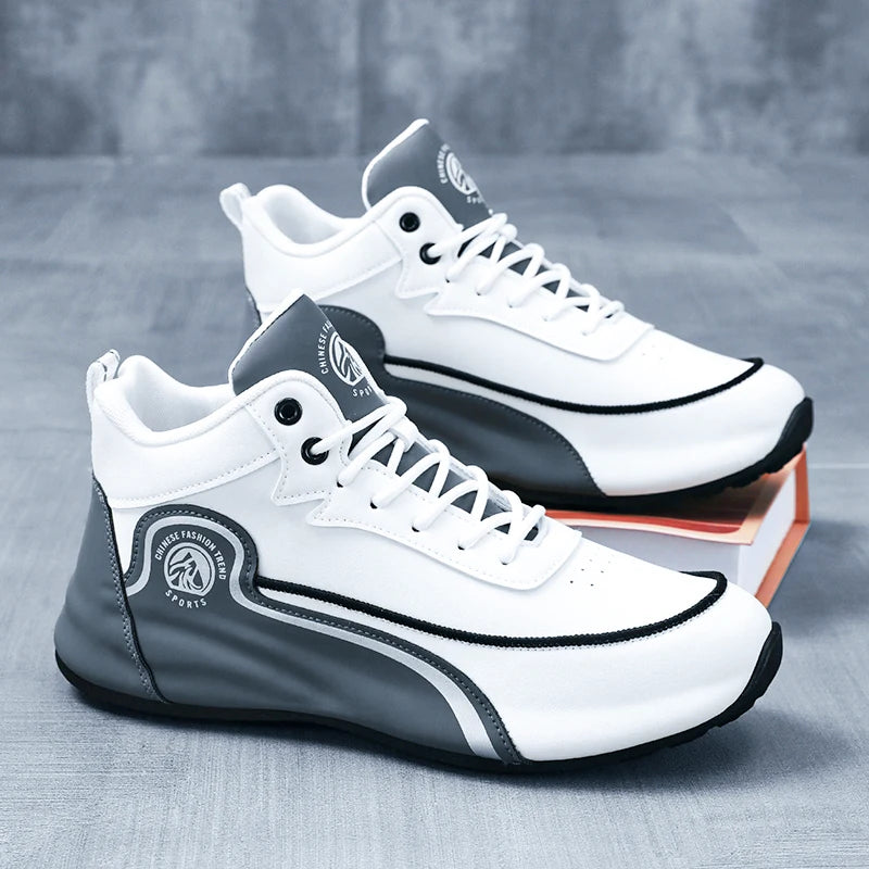 White and gray sneakers with black accents on a gray surface