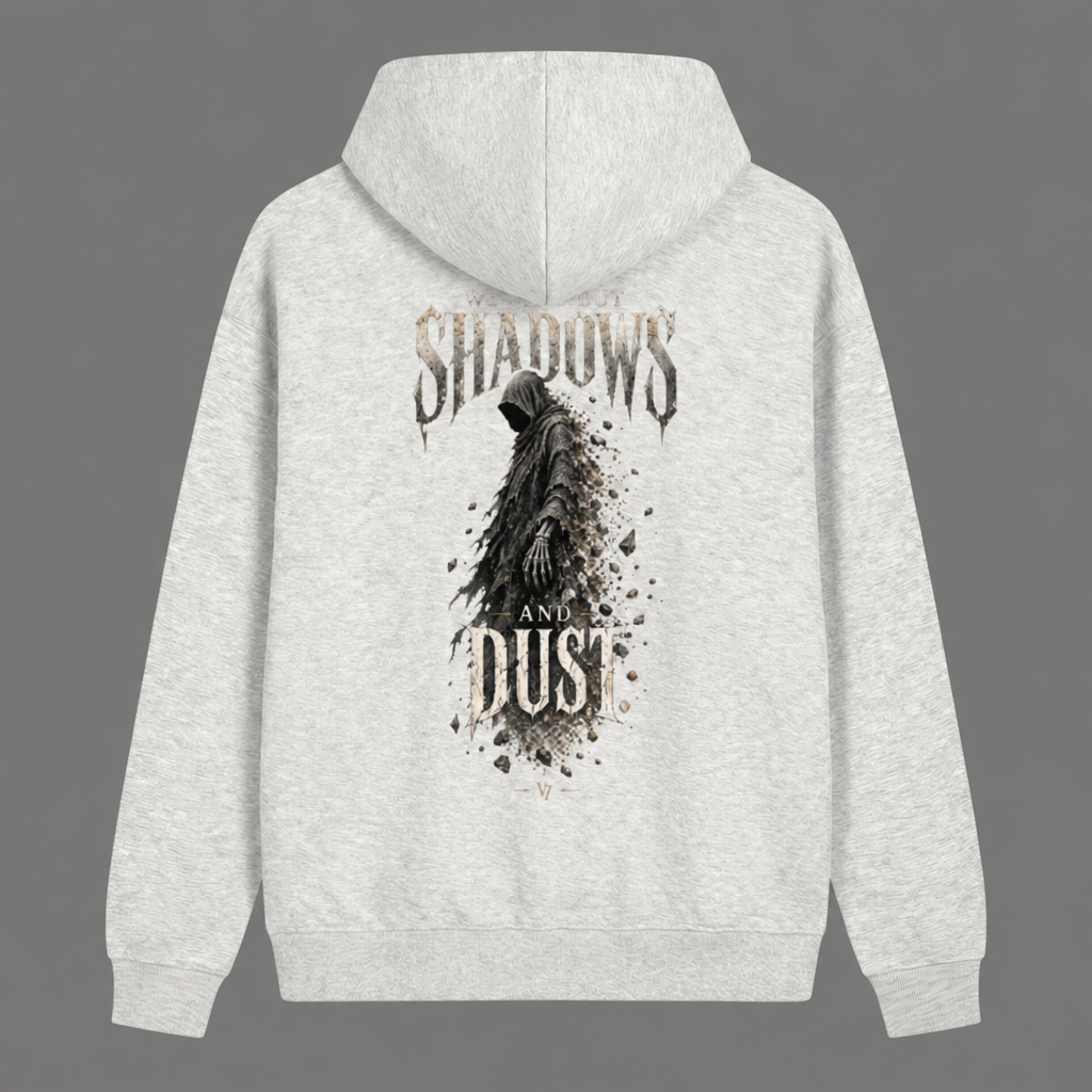 A light heather gray hoodie shown from the back, featuring a large graphic print of a hooded figure with a skeletal hand, surrounded by the words 'SHADOWS AND DUST' in a distressed, dark font.