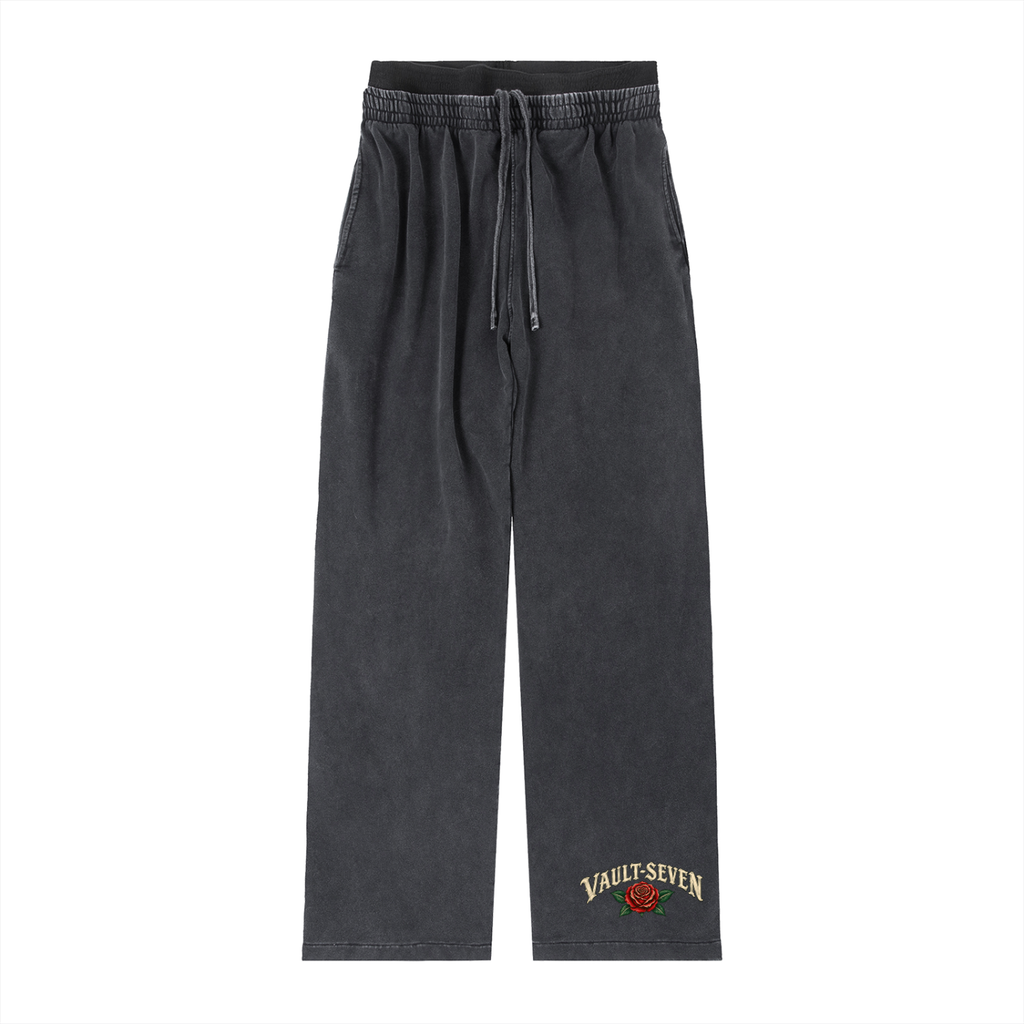 Dark gray washed sweatpants with an elastic drawstring waist and a small embroidered Vault Seven logo on the lower left leg, shown against a plain white background.
