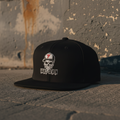Black Vault-Seven Street Issue Flatbill on a gritty concrete background