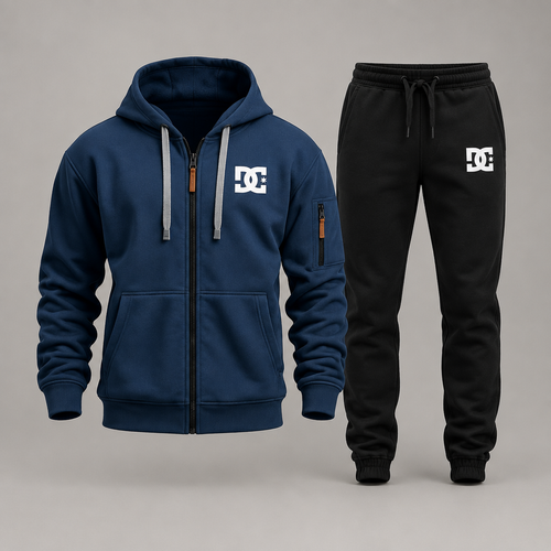 Navy blue DC zip hoodie with black joggers on a gray studio background