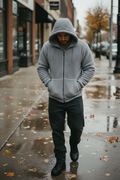 Mexican man gray wet sidewalk