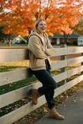 White woman khaki fence laugh